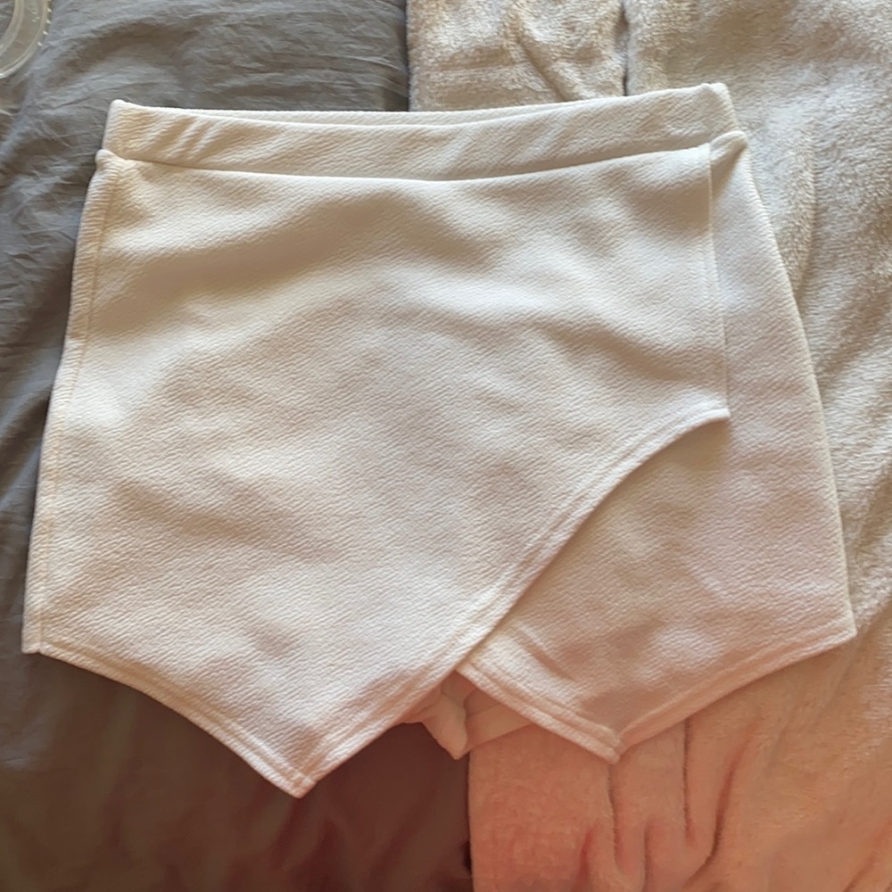 white crossover skirt with shorts inside